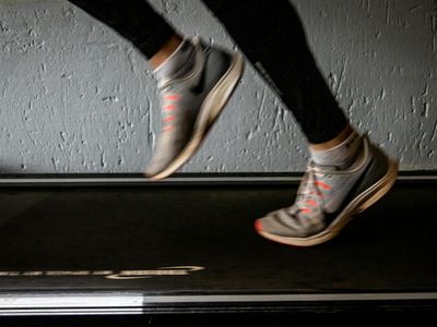 Blurred motion of legs running on a treadmill