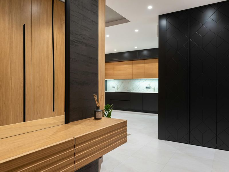 Bright minimalist training studio with wooden floors and neon accents